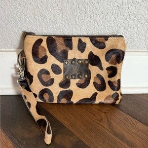 Keep it gypsy. Louis Vuitton wristlet